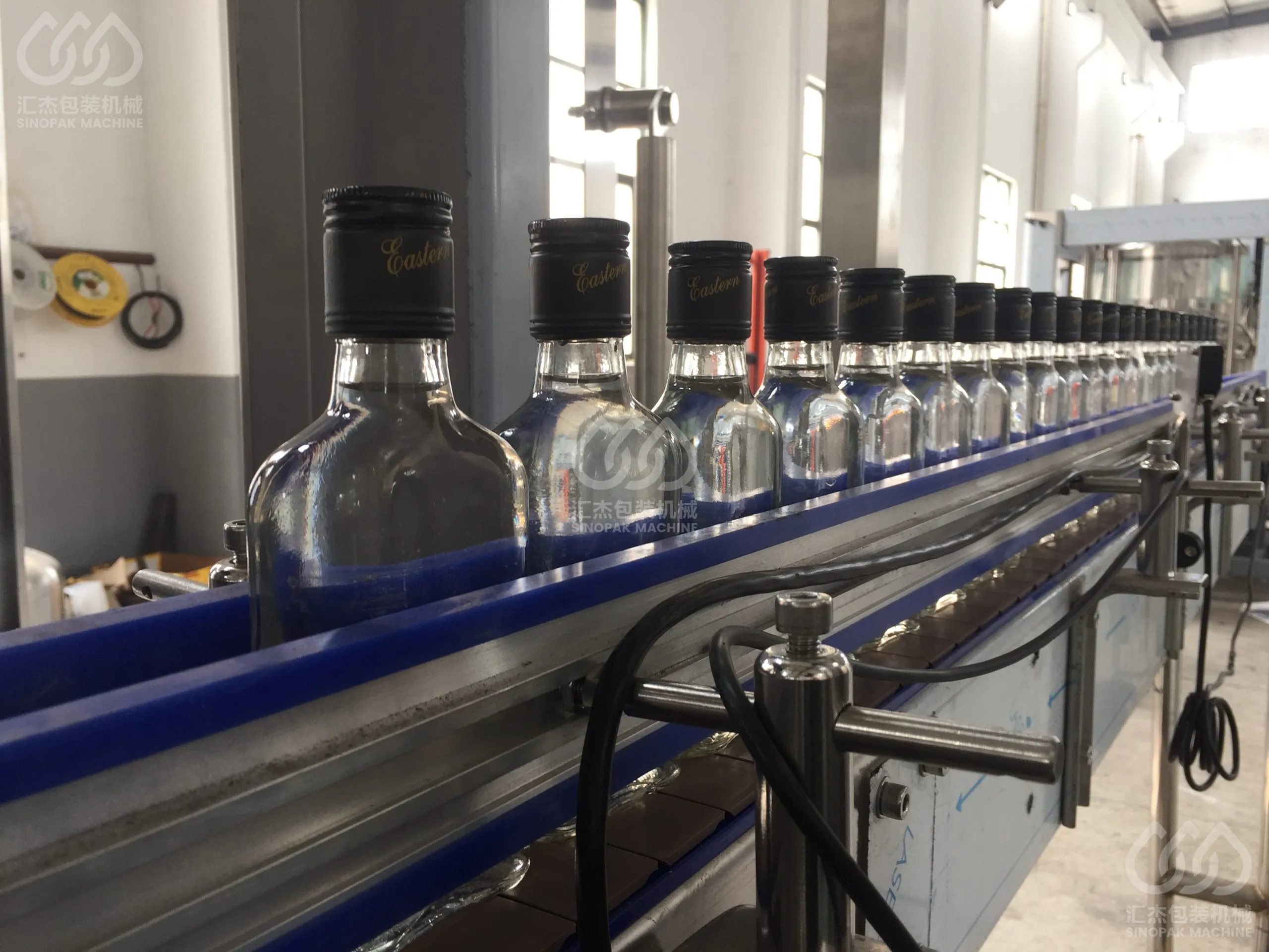 Liquor & Alcohol Filling Machine (Glass bottle ROPPCrown metal cap)