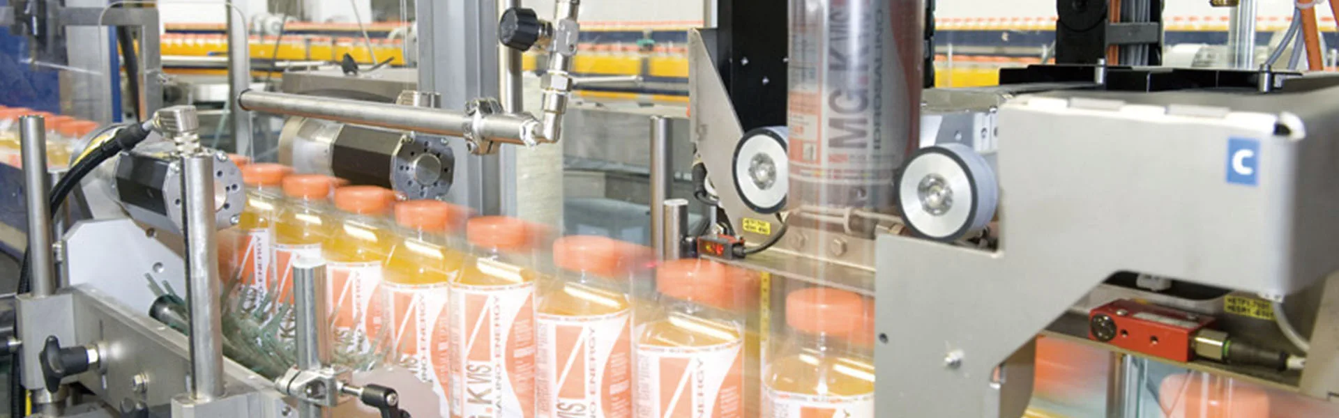 Beverage bottle labeling machine on a bottled drink production line
